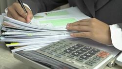 Hands young female business managers checking and arranging stack of unfinished documents reports papers for result graph marketing, new startup project for plans job succes in Busy office Stock Footage