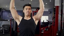 Young Asian muscular man exercising dumbbell shoulder press in the gym, lifestyle sport and bodybuilding concept Stock Footage