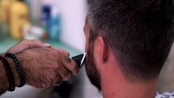 Barber Cuts the Hair in the Barbershop. Stock Footage