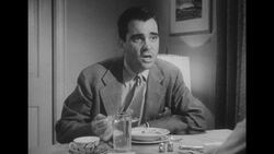 1950s: Husband looks up and speaks Stock Footage