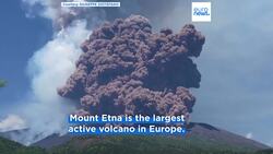 Massive plume of ash and volcanic material billows above Mount Etna as it erupts again News Clip