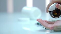 Female hand pour pills from medicine bottle. Medical health care Stock Footage