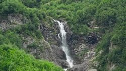 View waterfall scenes in mountains, national park Dombai, Caucasus, Russia Stock Footage