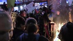 Protesters burn Trump hats outside rally Instructional Video