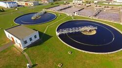Aerial view to sewage treatment plant. Grey water recycling. Waste management theme. Stock Footage