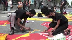 CLEAN : Canadian artists paint giant 'Black Lives Matter' mural in Montreal News Clip