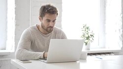 Businessman Celebrating Success, Working on Laptop Stock Footage