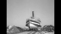Men moving Lake Champlain steamboat "Ticonderoga" by rail to museum in Shelburne, VT News Clip