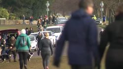 People walking and exercising in a park during national lockdown News Clip