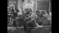 1960s: People sit in chairs in meeting room Stock Footage