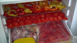 Housewife freezes fresh vegetables in the freezer Stock Footage