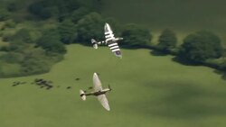 Flypast by a Spitfire and a Hurricane during Dame Vera Lynn's funeral News Clip