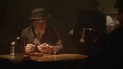 1920's reenactment of man in bowler hat dealing cards Stock Footage