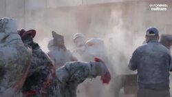 Flour and eggs become artillery as Spanish revellers celebrate El Enfarinats festival News Clip