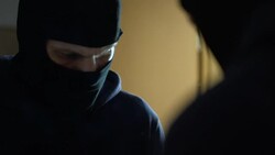 Manslaughter, professional robber looking at bloody hands in front of mirror Stock Footage