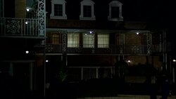 ZOOM IN ON WINDOWS OF SECOND STORY, LAW OFFICE BUILDING. NEW ORLEANS-STYLE WITH MANSARD ROOF. SIGN 'LAW OFFICES'. CARS DRIVING ON STREET IN FG. BUILDING IS LOCATED ON GREEN STREET IN PASADENA. ATTORNEY OFFICES. BRICK BUILDINGS. INTERIOR LIGHTS ARE ON. MAT Stock Footage