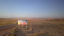 Aerial Drone Footage of Semi-Trucks Passing Utah State Line Stock Footage