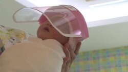 CLEAN : Newborns given tiny face shields at a Bangkok hospital News Clip