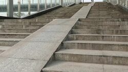 Woman free rider riding down ramp of overpass in city Stock Footage