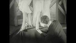 Man measures hemlines and inspects shoes, c.1920s Stock Footage