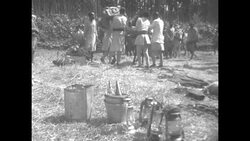 Ethiopian men load supplies onto donkeys News Clip