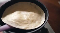 PreparationPancake Into A Pan with egg on the other side, 4k Stock Footage