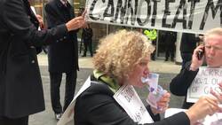 Environment protesters 'eat money' in London News Clip