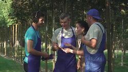 Gardeners look at the tablet and talk Stock Footage