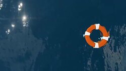 Lifebuoy Floating on Sea with Sharks Swimming underneath, zoom out Stock Footage