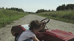 A cute little girl checks the work of her car Stock Footage