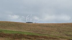 Wind turbines next to a Scottish loch Stock Footage