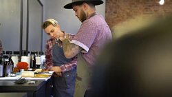 Barber lubricating electric razor by colleague Stock Footage