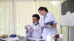 Professional medical professionals team brainstorming in a meeting. Team of healthcare workers discussing in boardroom at hospital. Stock Footage