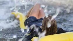 Woman refreshes under a fountain Stock Footage
