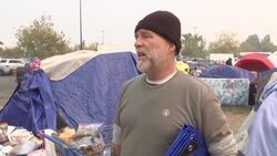 Wildfire evacuees living in tents near parking lot News Clip