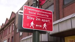 Stay 2 meters apart sign News Clip
