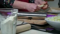 Young woman preparing food Stock Footage