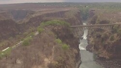 Drone aerials over the Victoria Falls and Zambezi River News Clip
