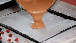 Pouring cake batter onto baking sheet. Making Chocolate Layer Cake. Stock Footage