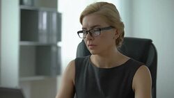 Office employee feeling neck pain, working in front of computer, overworked lady Stock Footage
