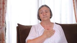 Senior woman suffering from heartache at home Stock Footage