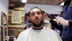 man and stylist doing haircut at barber shop Stock Footage