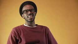 Cheerful Black Man Gesturing before Camera Stock Footage