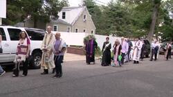 Community gathers for interfaith vigil in support of deported migrants News Clip