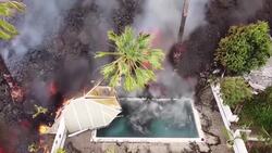 Drone footage of Spanish volcano shows lava swallowing swimming pool News Clip
