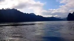 view of landscape limestone mountain rang and green forest with water lake Stock Footage
