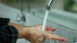 Close-Up young asian woman wash hands in public toilet at public park. Stock Footage