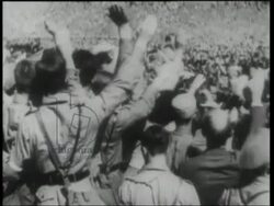 RESEARCH IMW995653 Hitler drives through crowds of Hitler Youth singing their anthem, Vorwarts! Vorwarts!, in Nuremberg, 1934 Stock Footage