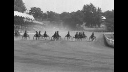 Intruder wins Hambletonian with driver Ned Bower; commentator Marty Glickman and cameraman Lou Hutt working News Clip