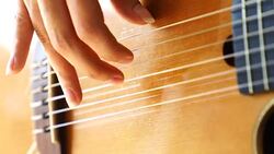 Musician playing classic guitar Stock Footage